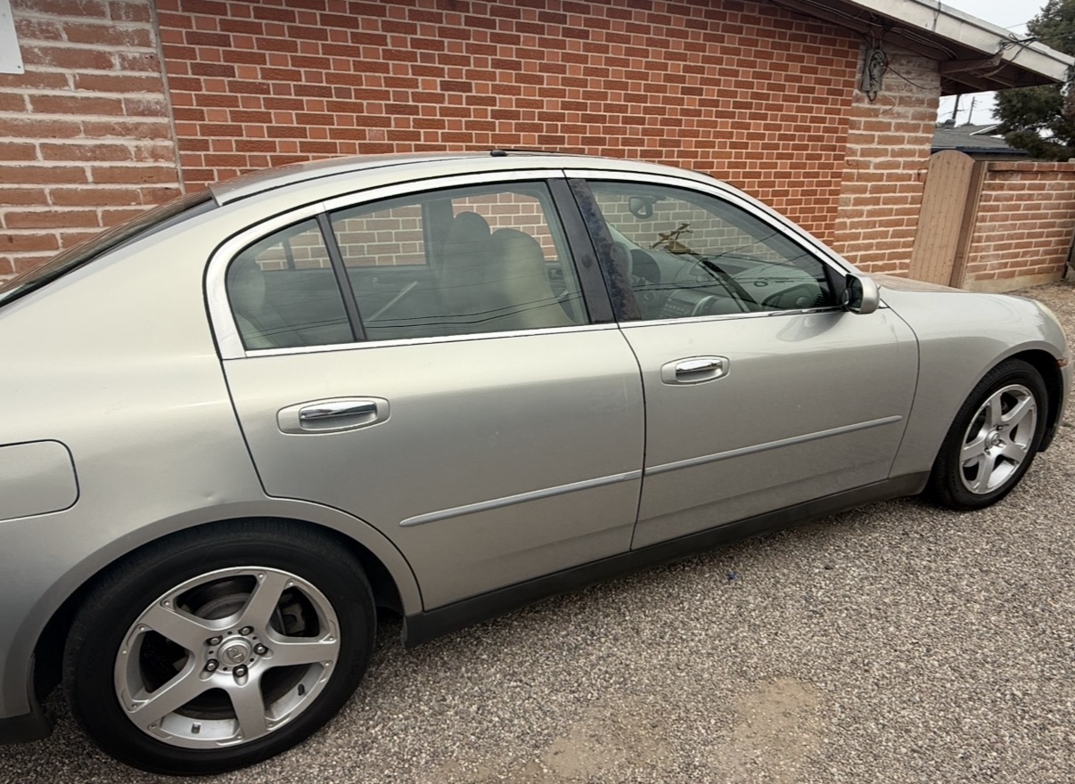 Silver Infiniti G35 with side tint