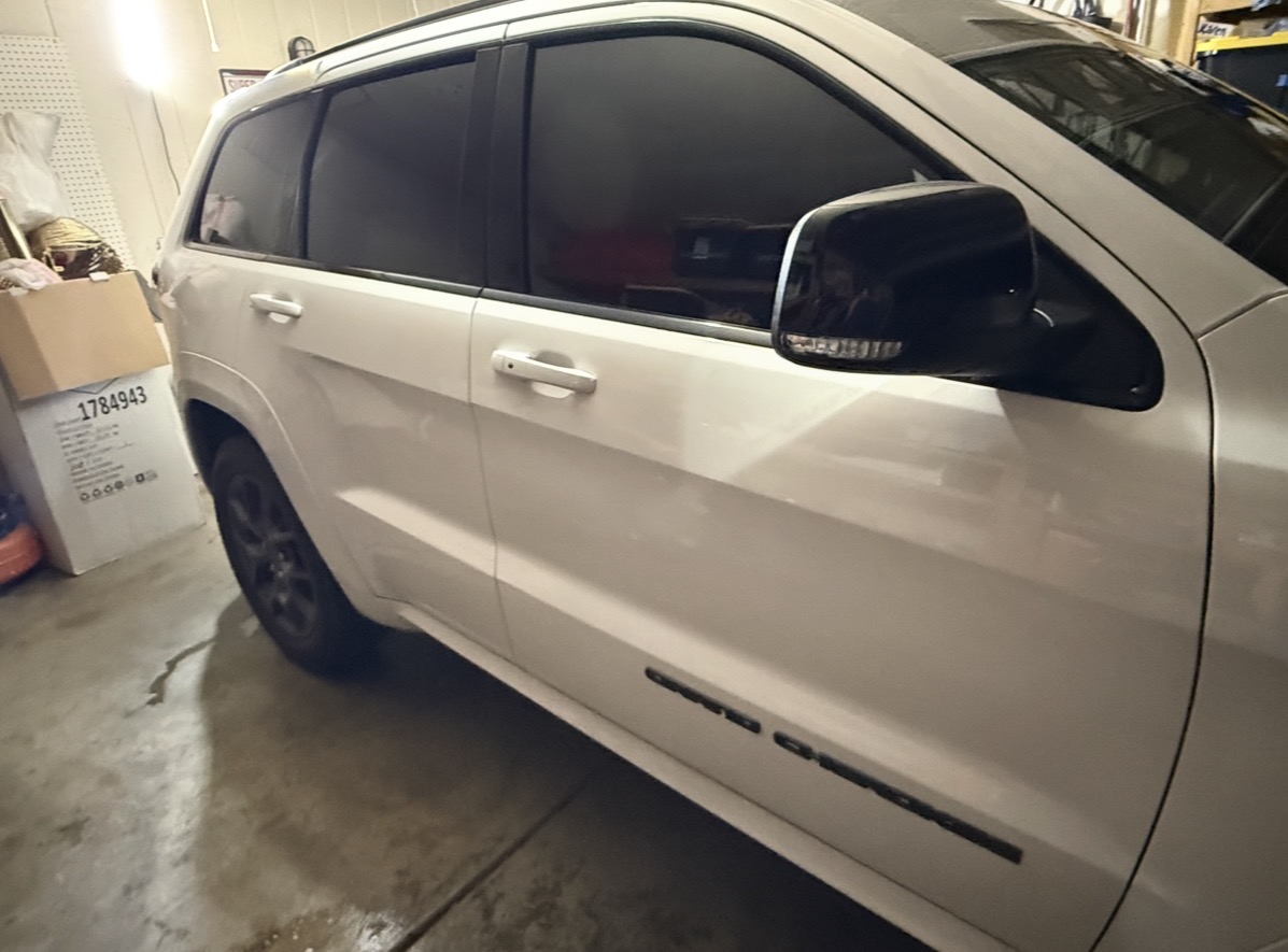 Jeep Grand Cherokee side view with dark tint