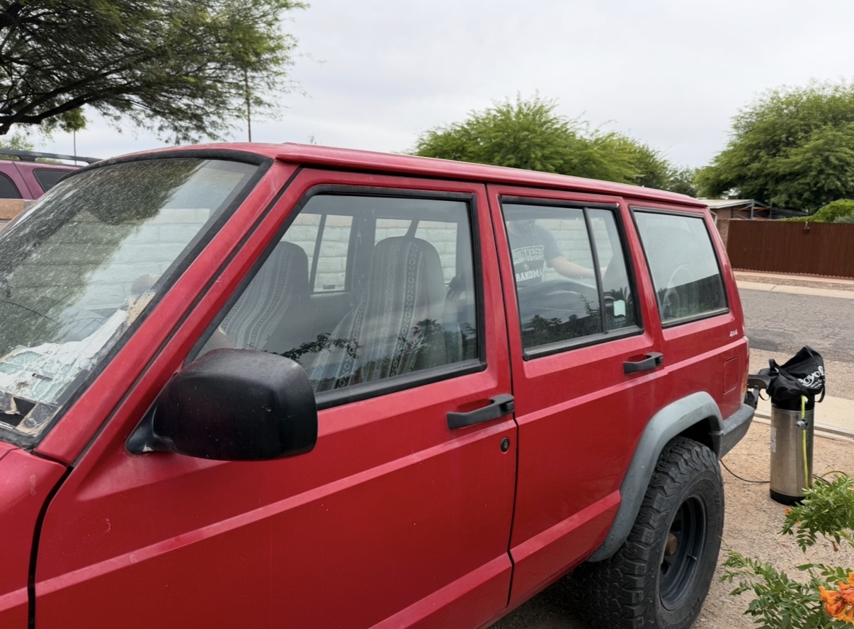 Jeep Cherokee side view with dark tint installed